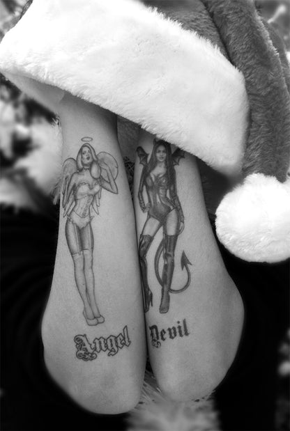 Two forearms with Pin-Up Girls temporary tattoos—one an angel labeled 'Angel' and the other a devil labeled 'Devil'